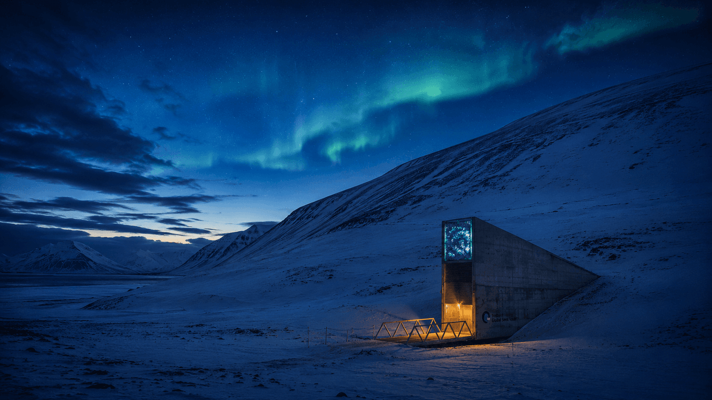 A remote Arctic landscape at twilight with a modern concrete structure embedded in a snow-covered mountain