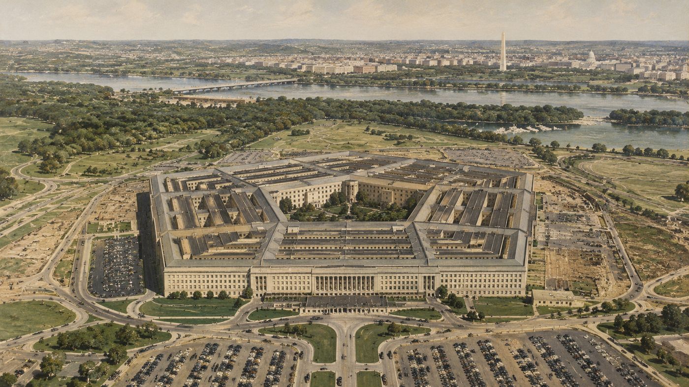 The Pentagon building seen from above, its five-sided structure surrounded by parking lots and Arlington Virginia landscape, the Potomac River visible beyond