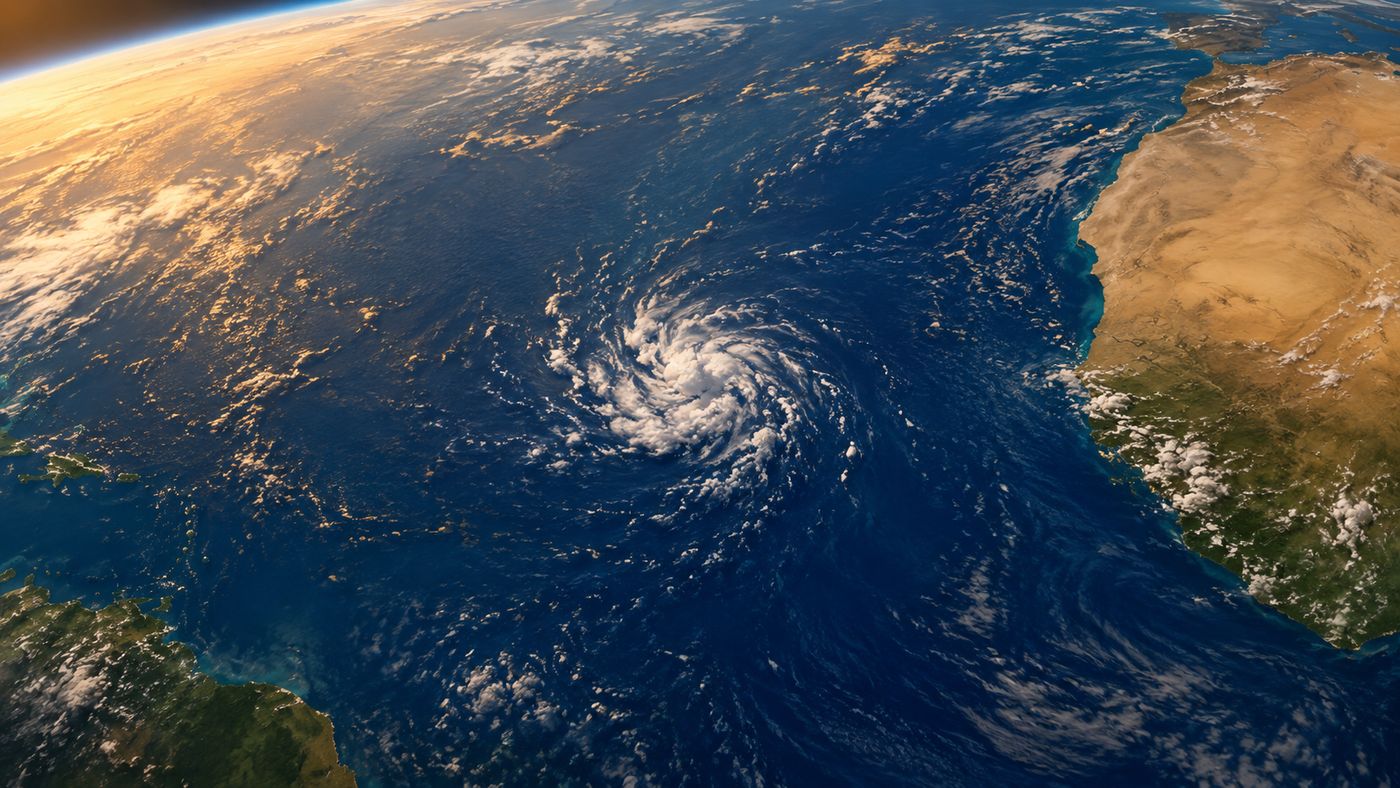 A NOAA satellite image of a developing tropical system in the Atlantic, its spiral cloud bands just beginning to organize off the coast of Africa